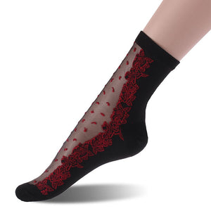 Chaussettes longues noir avec fleurs et petits pois rouges