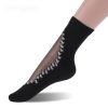 Chaussettes transparentes noires avec petites fleurs blanches