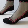 Chaussettes transparentes noires avec petites fleurs rose